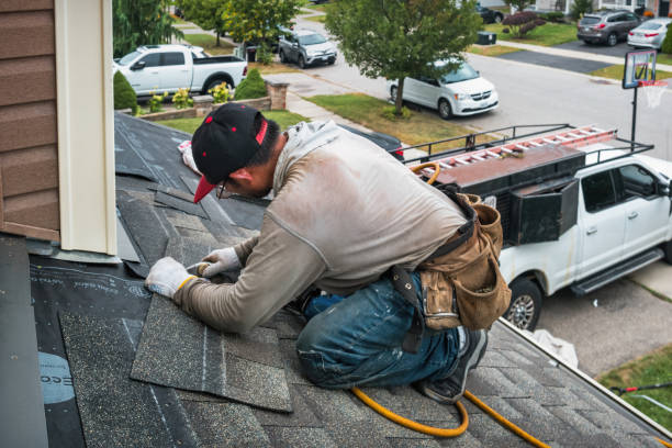 Professional Gutter Installation technician working in Westwood, MA